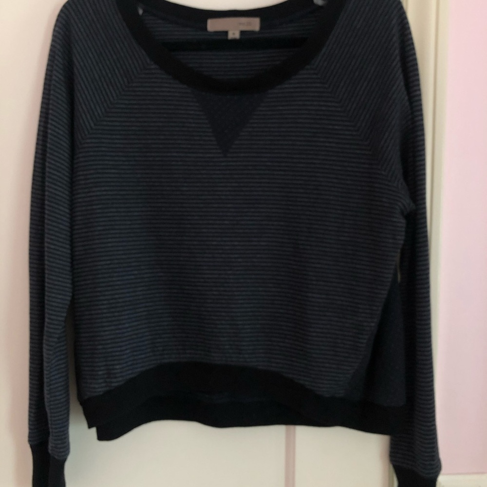 very dark navy blue sweater